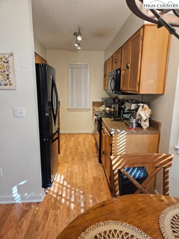 116 Grand Boulevard, Unit 1M Boone, NC 28607 - Photo 6 of 14 a bathroom with a sink a mirror and a shower