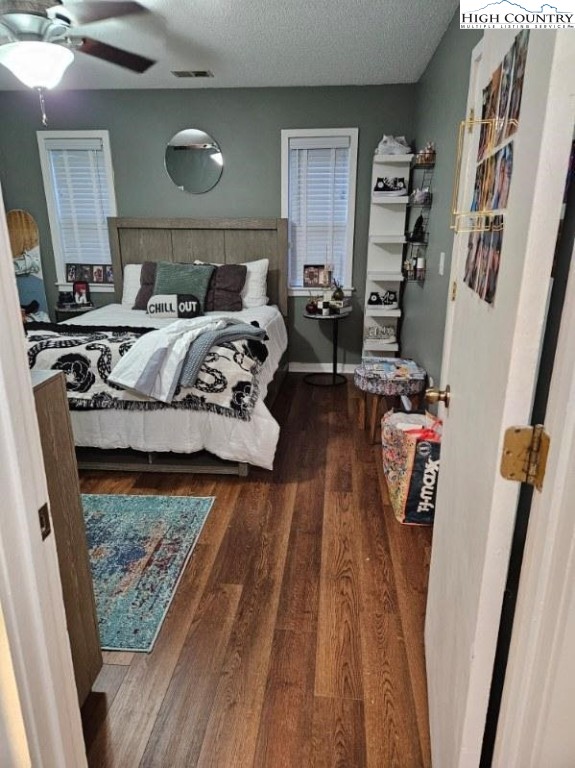 116 Grand Boulevard, Unit 1M Boone, NC 28607 - Photo 8 of 14 a bed sitting in a bedroom next to a window