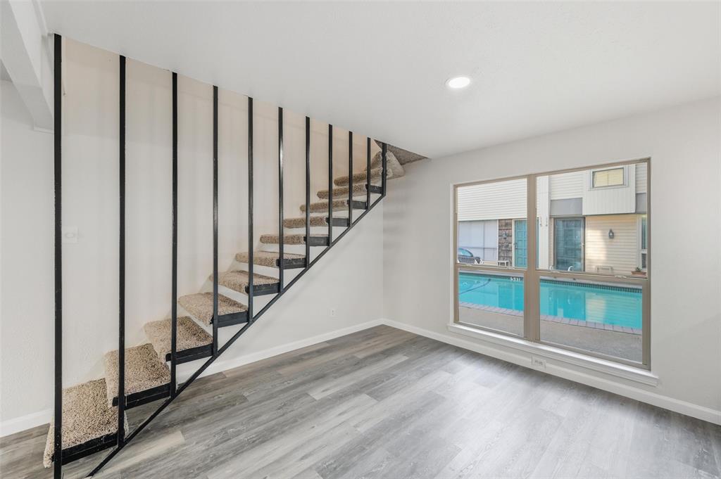 2702 Douglas Avenue, Unit 121 Dallas, TX 75219 - Photo 11 of 34 a view of entryway with wooden floor