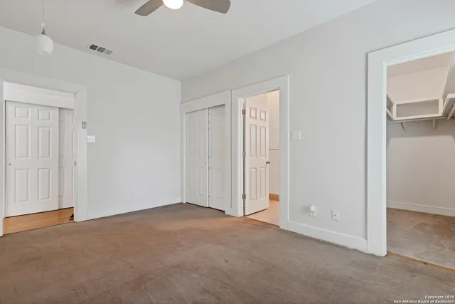 a bathroom with a granite countertop sink a mirror and a bathtub