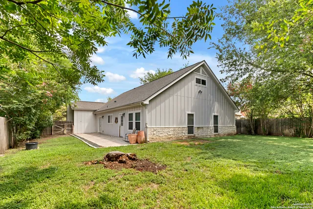a view of a back yard of the house