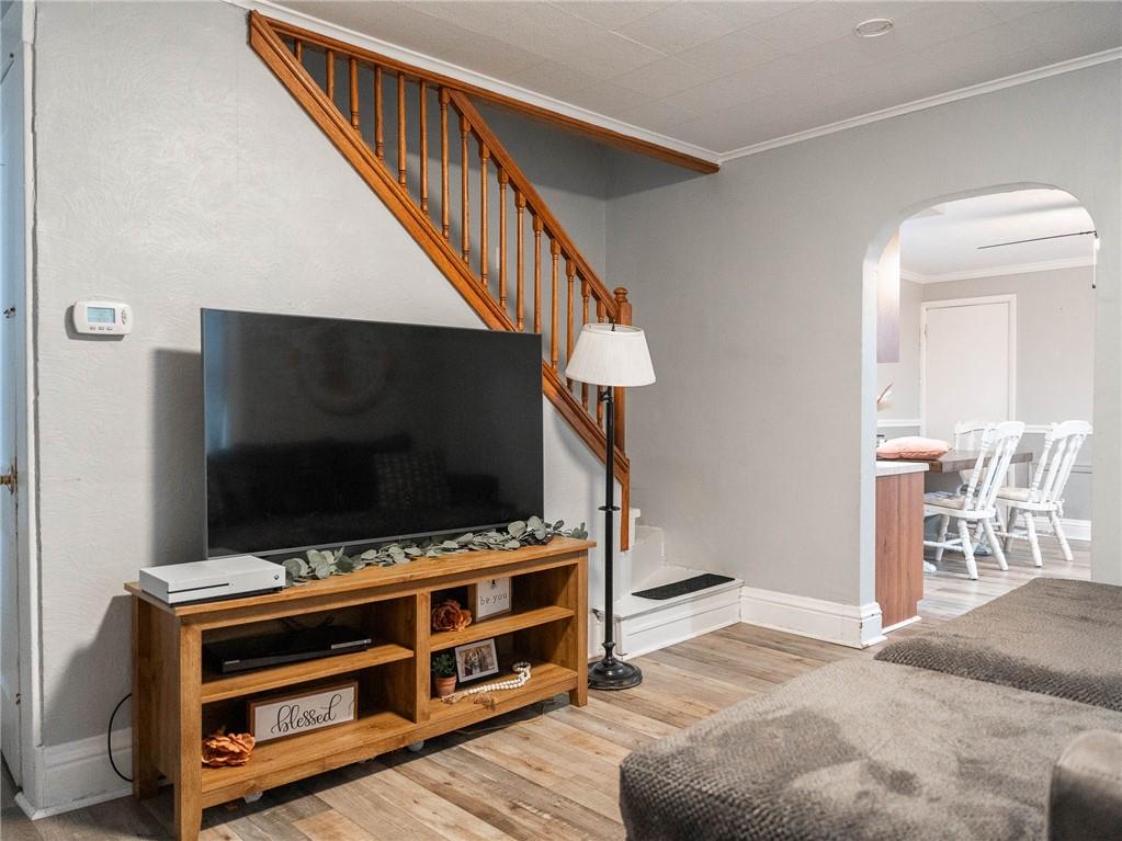 631 Connecticut Avenue Rochester, PA 15074 - Photo 14 of 40 a room with furniture and flat screen tv