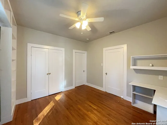 a bedroom with a bed and a fireplace