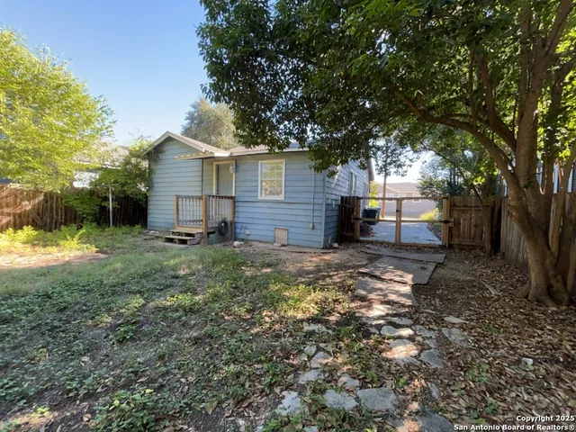 a view of a house with a small yard