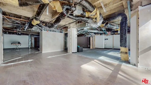 a view of a room with wooden walls