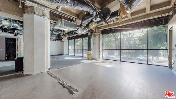 a view of a garage with wooden floors
