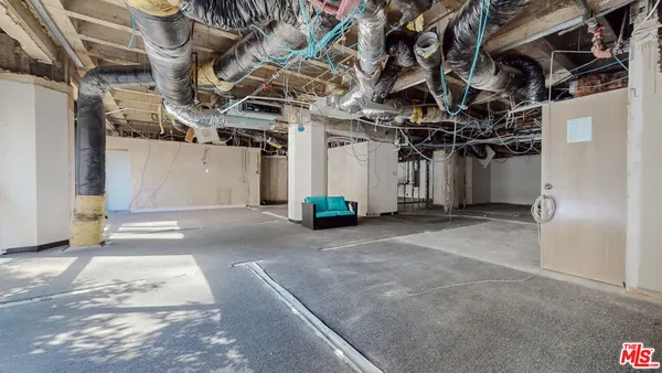 a view of a garage with wooden wall