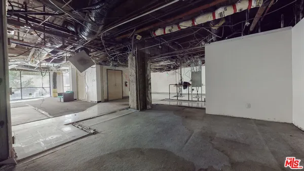 a view of a room with wooden walls