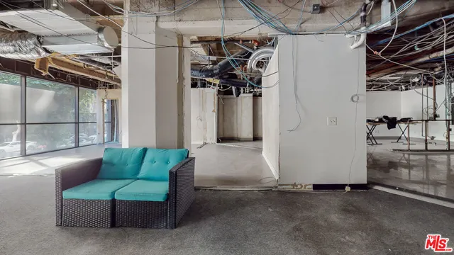 a view of a room with wooden walls