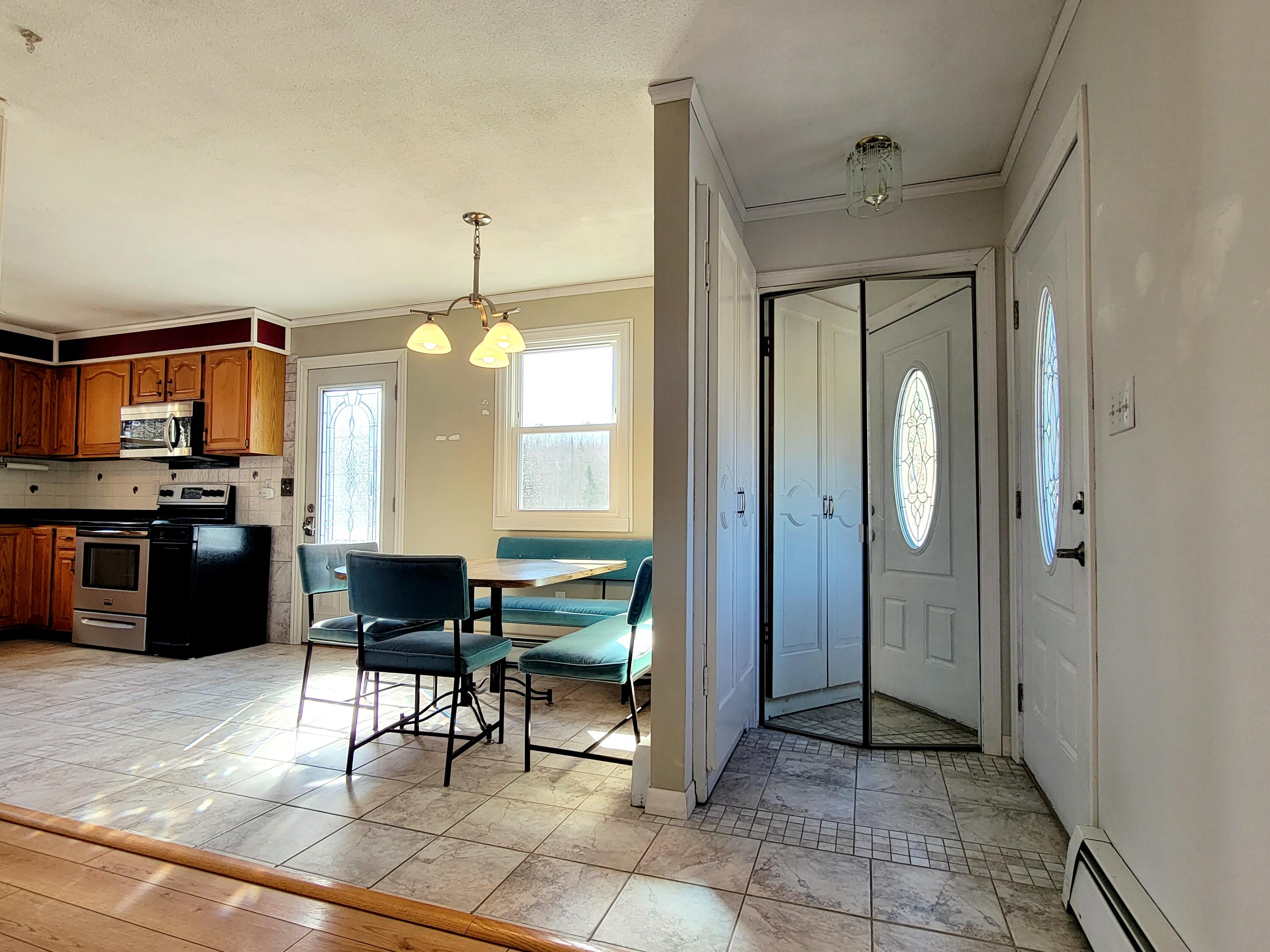 1045 Dodlin Road Enfield, ME 04493 - Photo 16 of 60 Living room view toward kitchen/dining