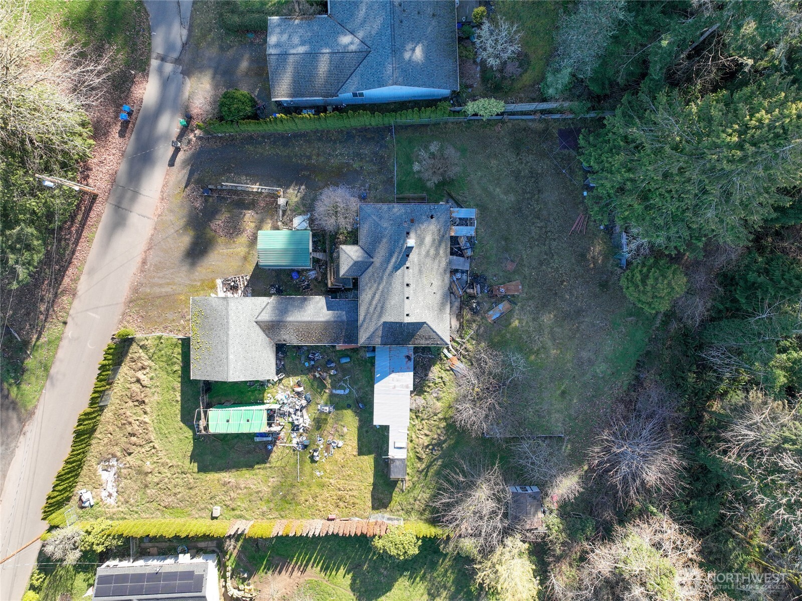 8161 Sandy Road Northeast Bremerton, WA 98311 - Photo 11 of 17 an aerial view of a house with swimming pool and a yard