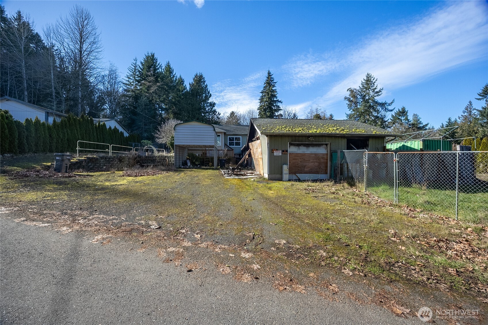8161 Sandy Road Northeast Bremerton, WA 98311 - Photo 3 of 17 a view of a house with backyard and a tree