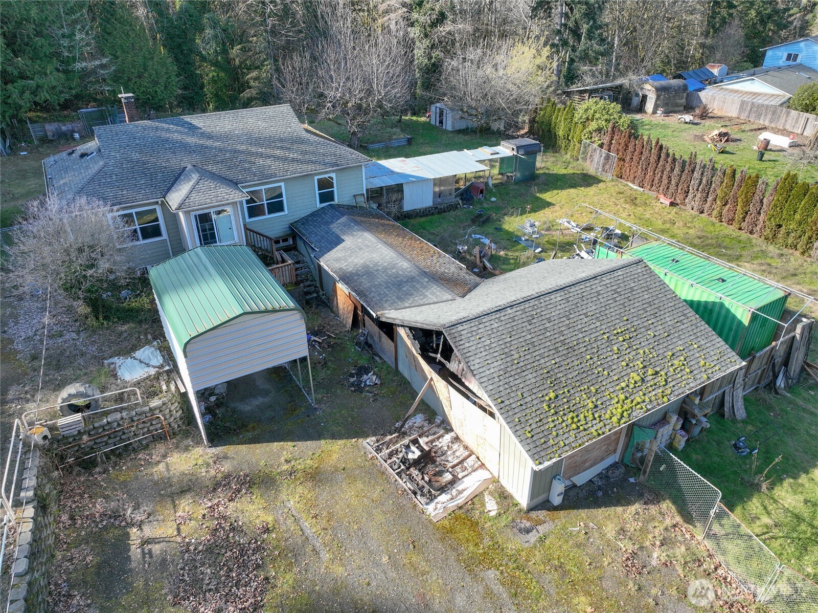 8161 Sandy Road Northeast Bremerton, WA 98311 - Photo 4 of 17 an aerial view of a house with a yard patio and outdoor seating