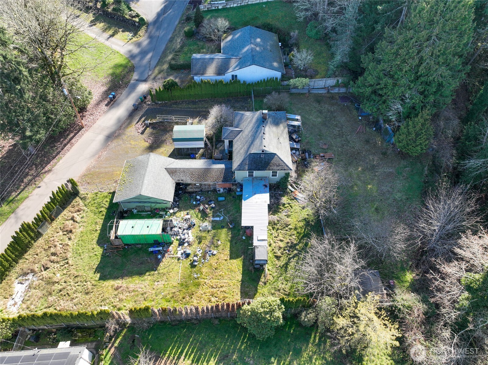 8161 Sandy Road Northeast Bremerton, WA 98311 - Photo 8 of 17 an aerial view of a house with a garden and swimming pool