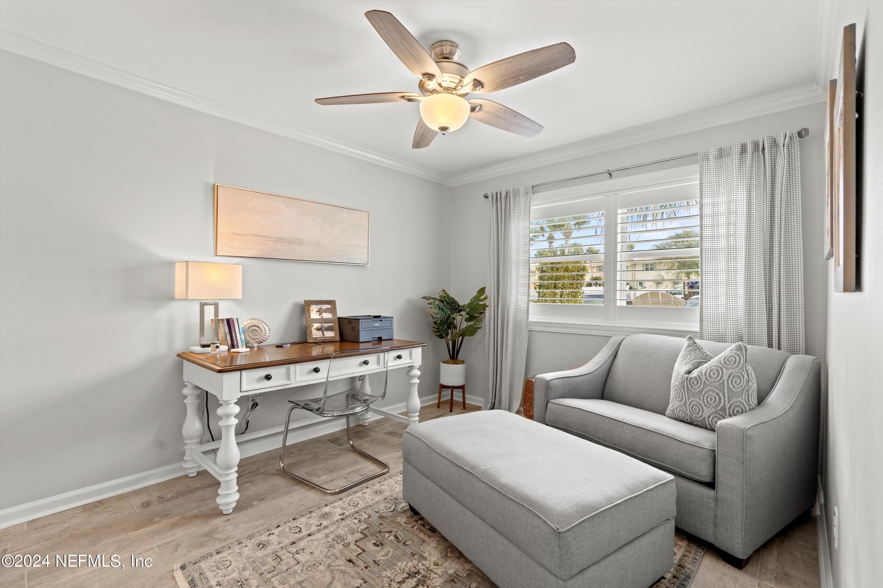 2233 Seminole Road, Unit 31 Atlantic Beach, FL 32233 - Photo 11 of 38 a living room with furniture and a large window