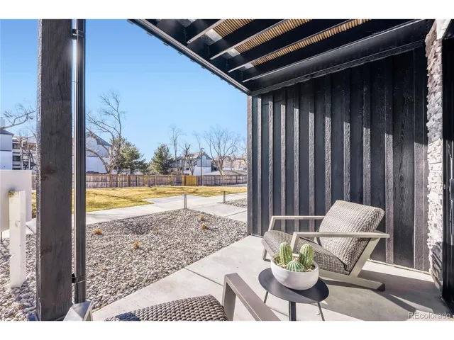 a view of a patio in the backyard