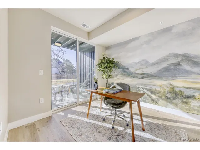 a living room with furniture and a gate