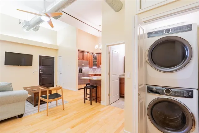 a view of a livingroom with furniture and a flat screen tv