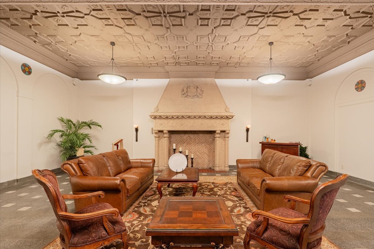 212 North Center Street, Unit 104 Bloomington, IL 61701 - Photo 16 of 22 a living room with furniture and a fireplace