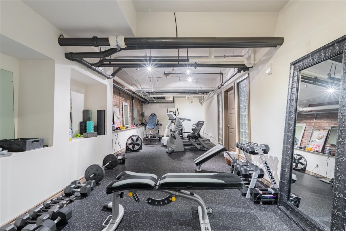 212 North Center Street, Unit 104 Bloomington, IL 61701 - Photo 20 of 22 a view of a room with gym equipment