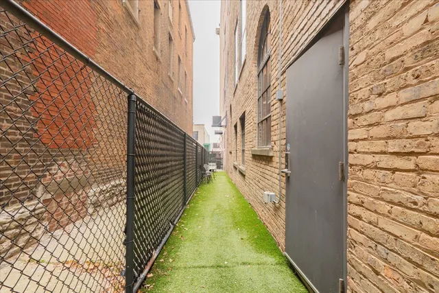 a view of a pathway of a building from a balcony