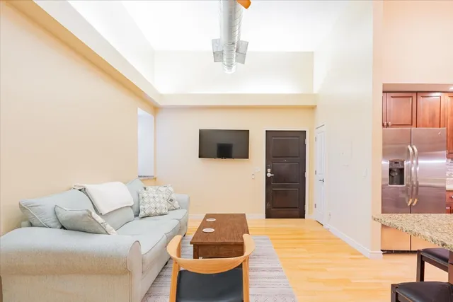 a living room with a couch and a flat screen tv