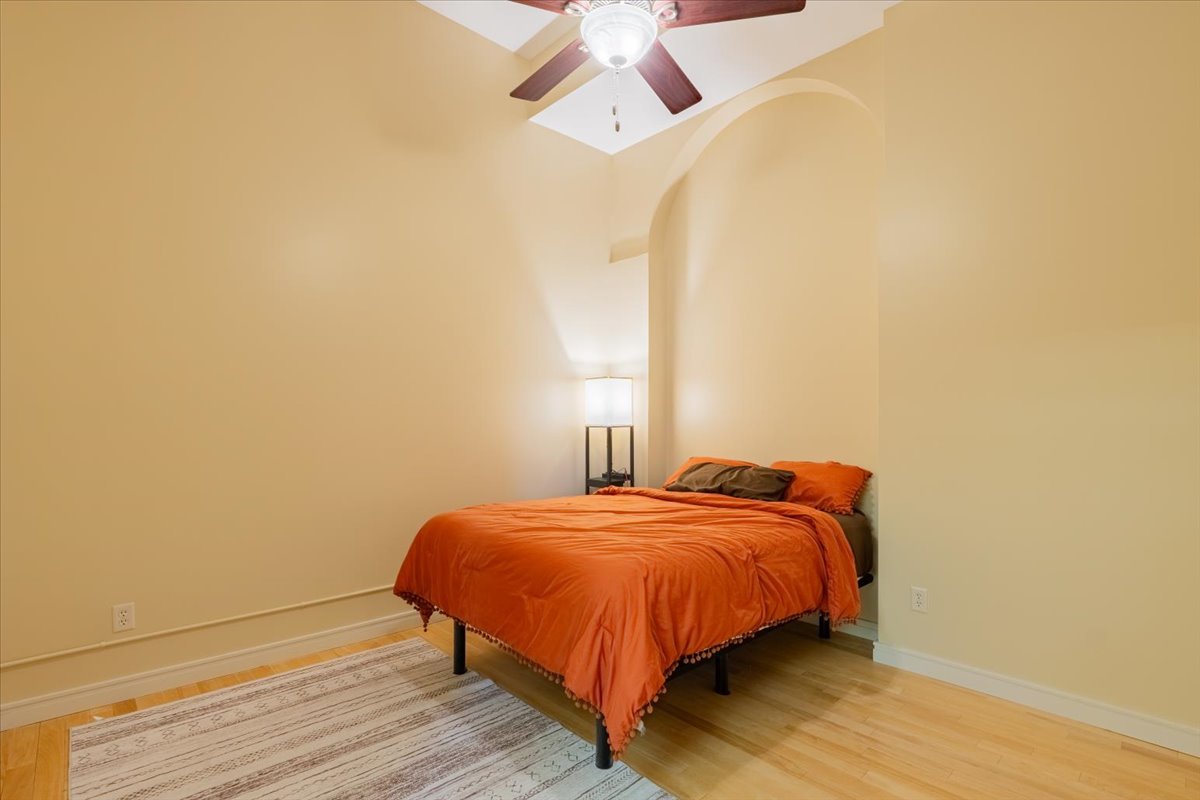 212 North Center Street, Unit 104 Bloomington, IL 61701 - Photo 7 of 22 a bedroom with a bed and a window