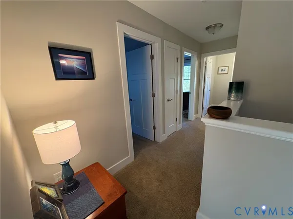 a view of a livingroom with furniture and windows