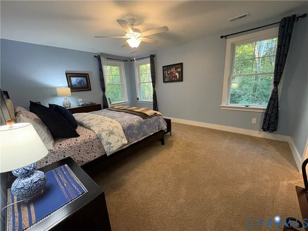 a bedroom with bed and window