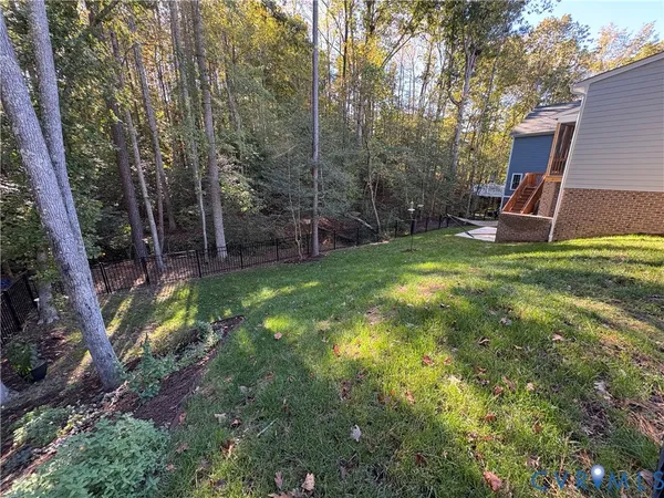 a view of a backyard with a tree
