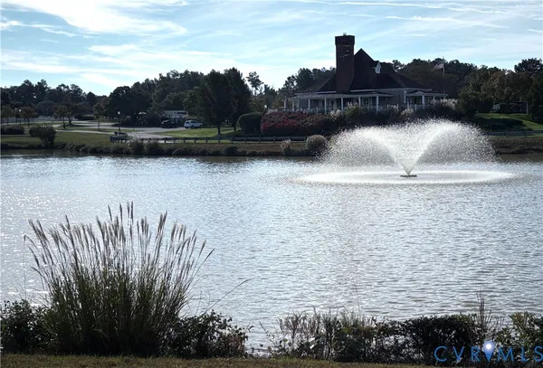 a view of a lake with a building in the background