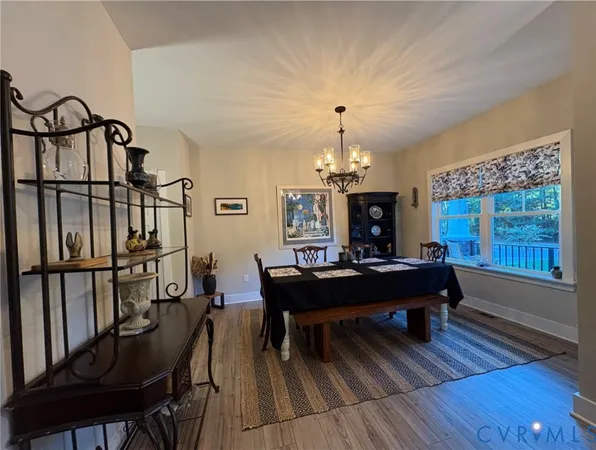 a view of a livingroom with furniture window and wooden floor