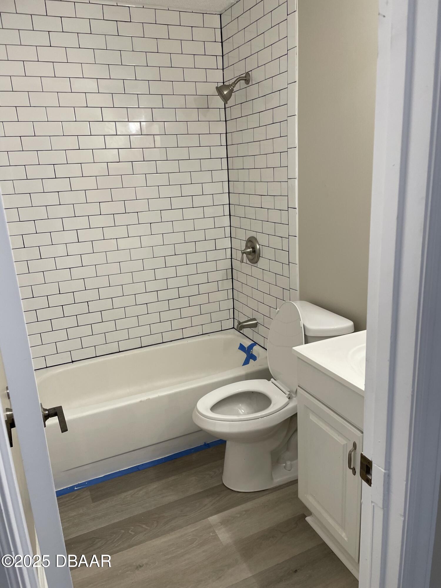 840 Center Avenue, Unit 75 Holly Hill, FL 32117 - Photo 13 of 17 a bathroom with a sink a toilet and bathtub