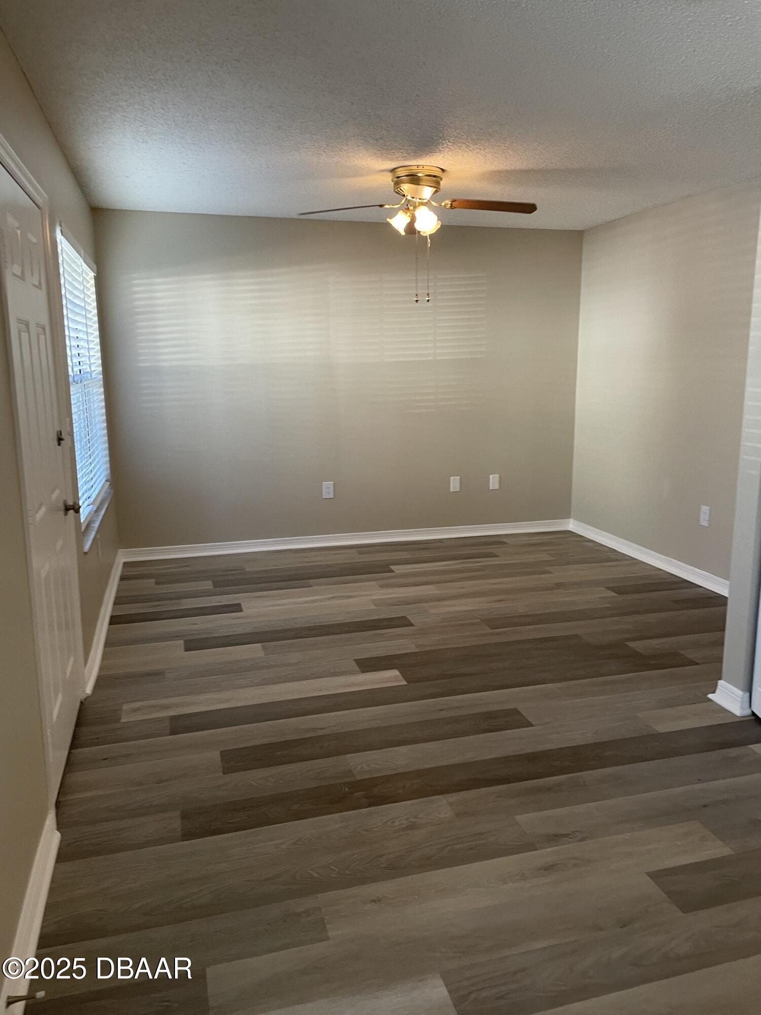 840 Center Avenue, Unit 75 Holly Hill, FL 32117 - Photo 3 of 17 a view of room with stairs and wooden floor