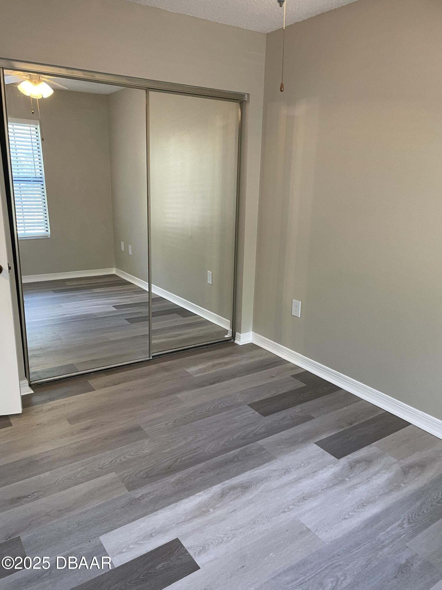 840 Center Avenue, Unit 75 Holly Hill, FL 32117 - Photo 10 of 17 a view of a room with wooden floor