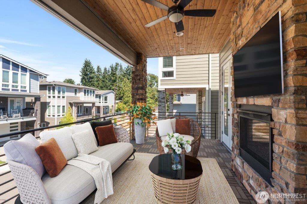 7544 South 129th Street Seattle, WA 98178 - Photo 5 of 9 a living room with furniture a fireplace and a flat screen tv