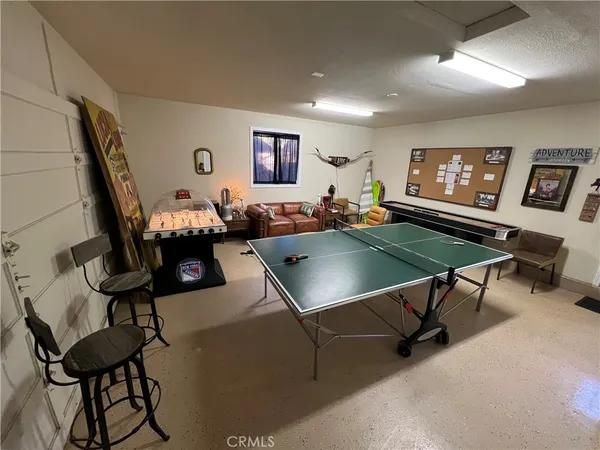 a living room with furniture a rug and a flat screen tv