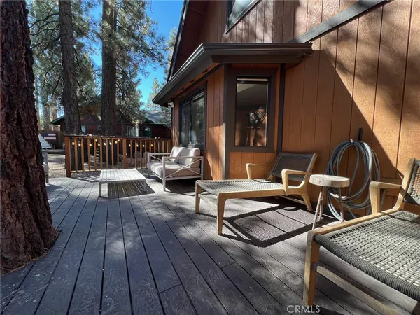 a view of a dinning tables and chairs in patio of the house