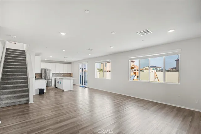 a view of kitchen with furniture and wooden floor