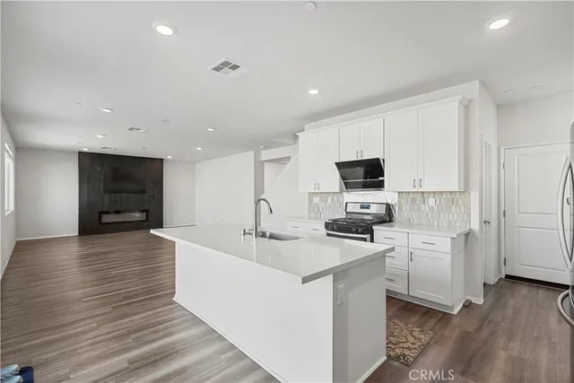 a view of an entryway with wooden floor