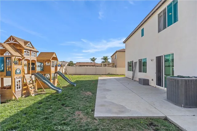 a view of an empty room with closet and bathroom