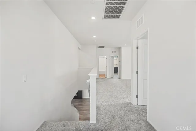 a bathroom with a sink a toilet a mirror and shower