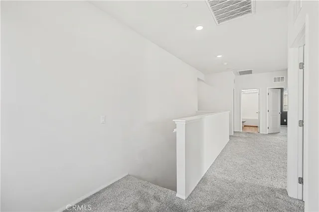 a view of a storage & utility room with dryer and washer