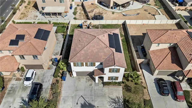 an aerial view of residential houses and outdoor space