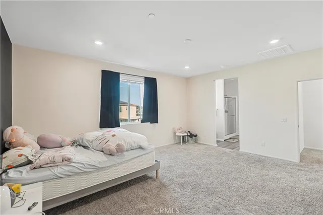 a view of a house with potted plants and a garage
