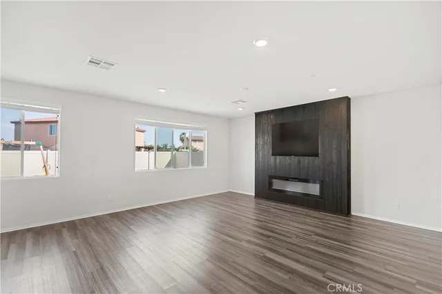 a view of an entryway with wooden floor