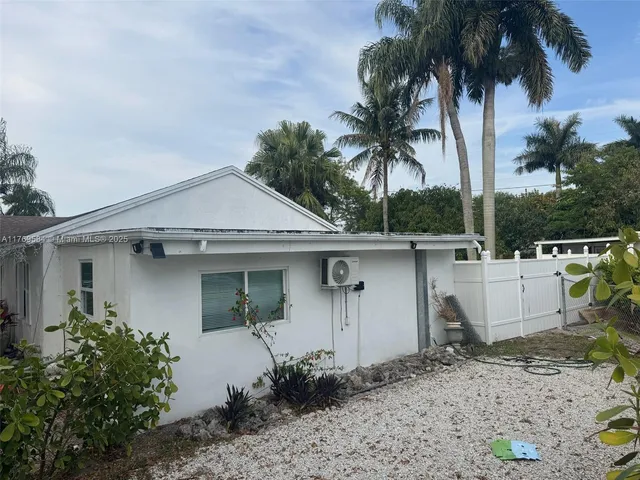 a view of a house with a yard and a garage
