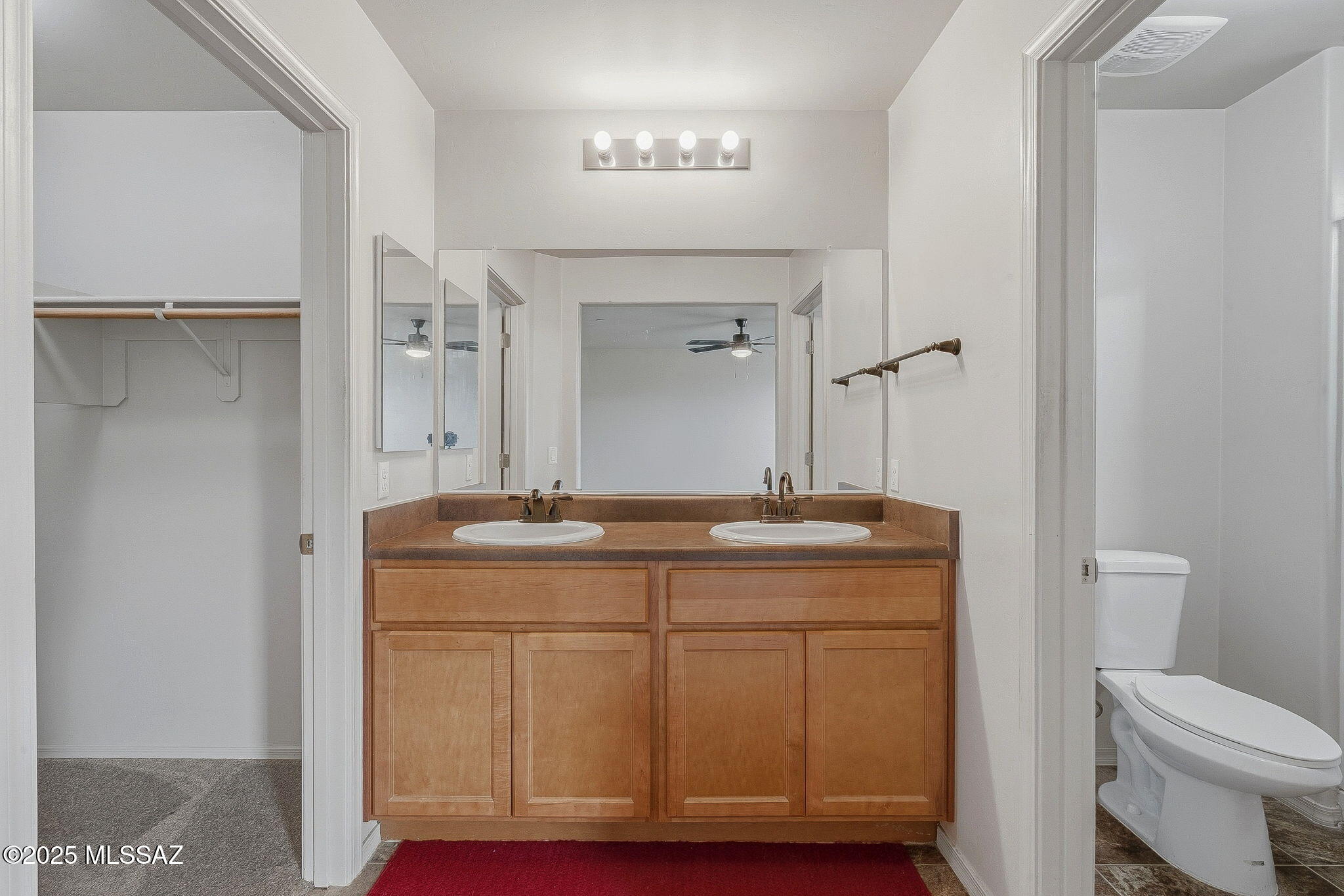 1458 North Wentworth Road Vail, AZ 85641 - Photo 22 of 44 a bathroom with a granite countertop sink a toilet and a mirror