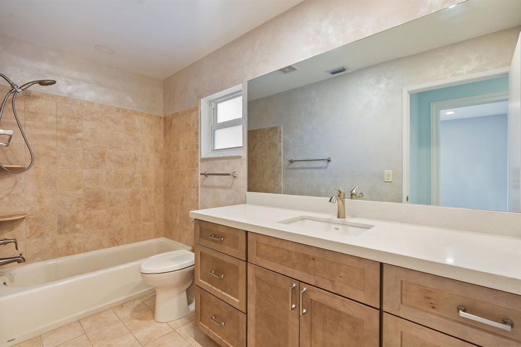 3240 Northwest 106th Avenue Sunrise, FL 33351 - Photo 15 of 21 a bathroom with a sink a toilet and shower