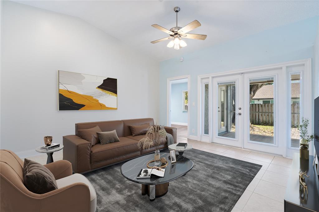 3240 Northwest 106th Avenue Sunrise, FL 33351 - Photo 4 of 21 a living room with furniture and a rug